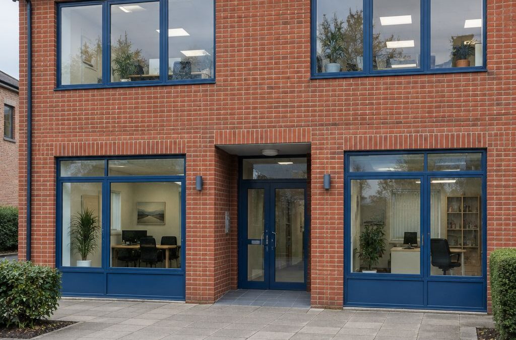 Shared entrance to a red-brick commercial building with separate office spaces